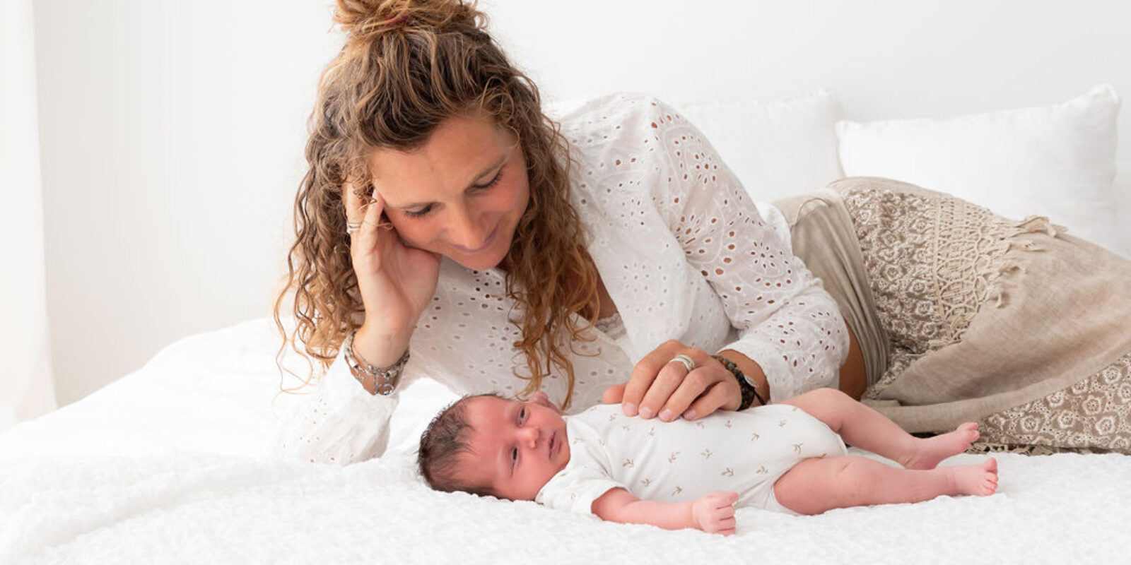 What does a postpartum care provider do, and when should you make arrangements for this?