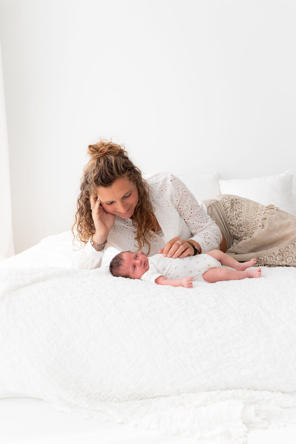What does a postpartum care provider do, and when should you make arrangements for this?